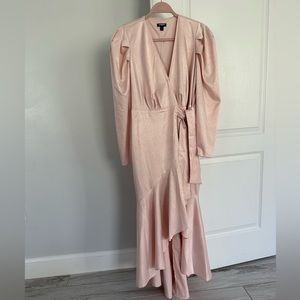 Express light pink dress long in the back shorter in the front. Tie closure